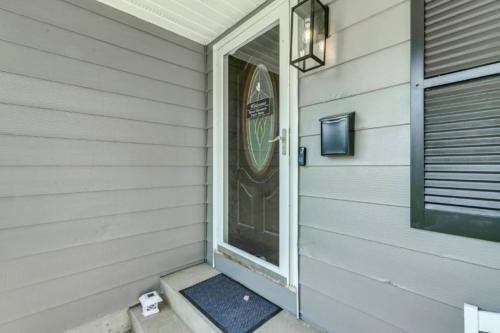 a front door of a house with a door mat at Owls Nest Cozy Westfield Home with Fire Pit in Westfield