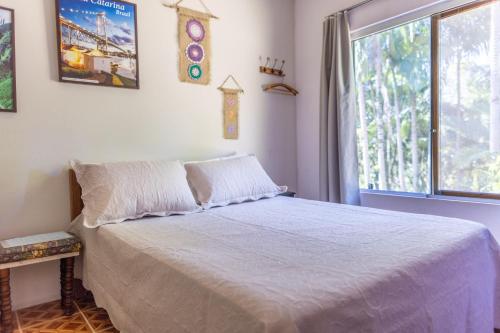Ένα ή περισσότερα κρεβάτια σε δωμάτιο στο Casa de Campo LEÃO BAIO - Antônio Carlos SC