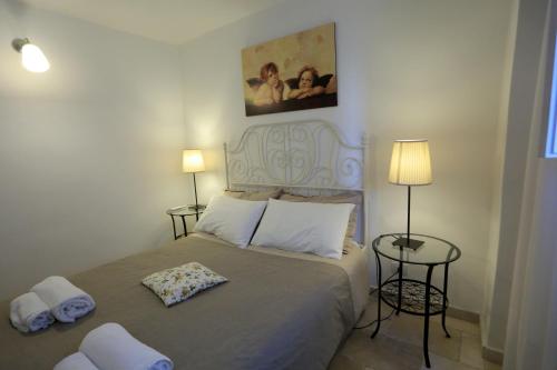 Een bed of bedden in een kamer bij La Casetta Nel Vico