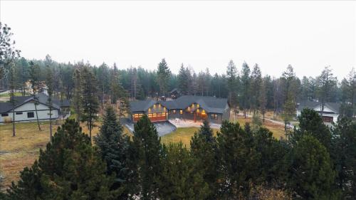 an aerial view of a house in a forest at Luxe Lakeside New Build by Flathead Lake Speakeasy in Somers