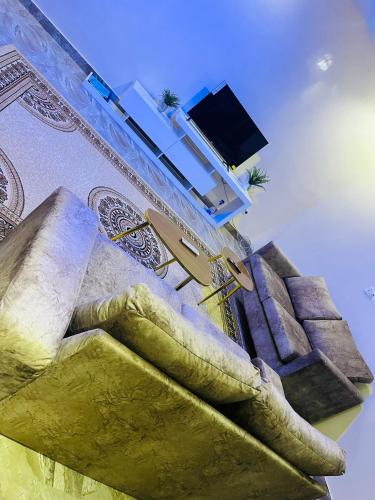 a view of a building with a television and stairs at RESIDENCE EL HADJI in Dakar