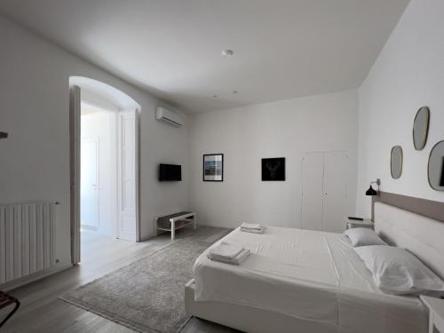 A bed or beds in a room at b&b boutique suite bari