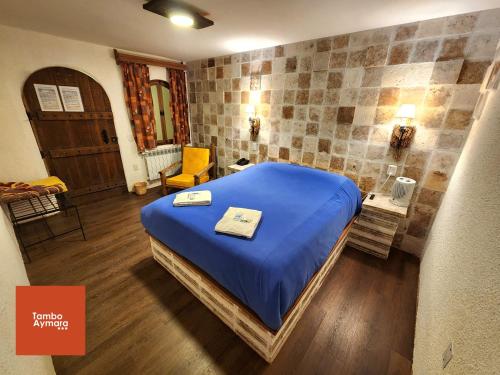 Una cama o camas en una habitación de Tambo Aymara