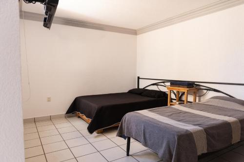 Postel nebo postele na pokoji v ubytování Lofts Oaxaca