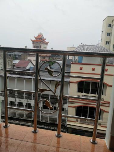 a view of a building from a balcony at Moon's House Hatyai มูนเฮ้าส์ หาดใหญ่ in Hat Yai