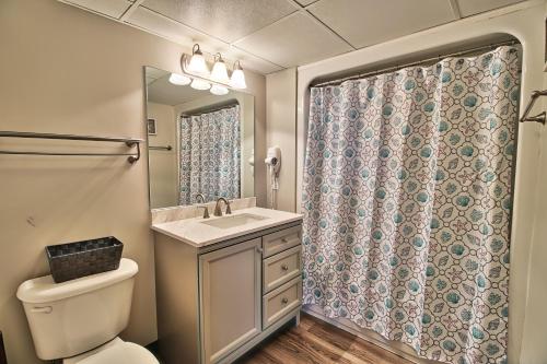 a bathroom with a toilet and a sink and a shower at Seas The Day - Stunning Ocean Views, Direct Beach Access, Prime Location! in Myrtle Beach