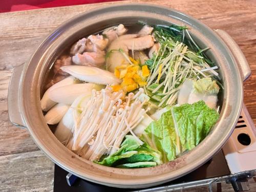 a pot full of food on a stove at Labo Land Kurohime in Shinano