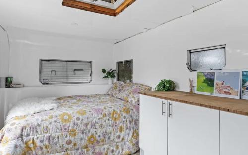 Ένα ή περισσότερα κρεβάτια σε δωμάτιο στο White Beach Retreat