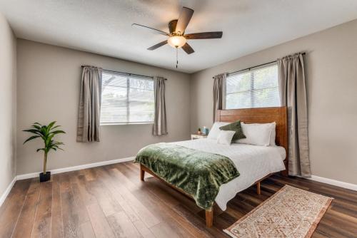 a bedroom with a bed and a ceiling fan at Farmhouse With Amazing Pool at Wester Hills Temple in Temple