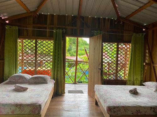 Postel nebo postele na pokoji v ubytování Hotel cahuita