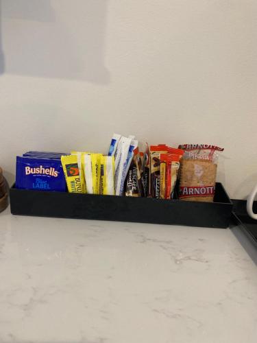 a shelf filled with different types of snacks at The Belmont Hotel in Belmont
