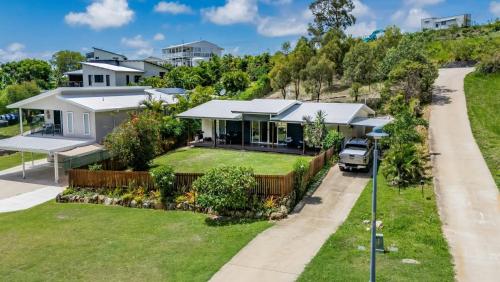 an aerial view of a house with a driveway at Bayview - Three Bedroom, Family & Pet Friendly Coastal Getaway in Agnes Water in Agnes Water