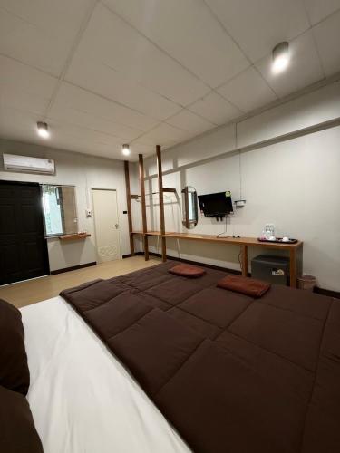 a large room with a large rug on the floor at theriverhouse in Ban Muang Nga