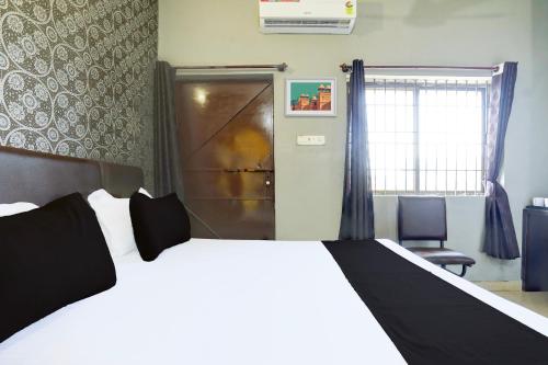 Postel nebo postele na pokoji v ubytování Hotel O Rewansh in