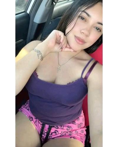 a woman in a purple dress sitting in a car at Bebe in Escárcega