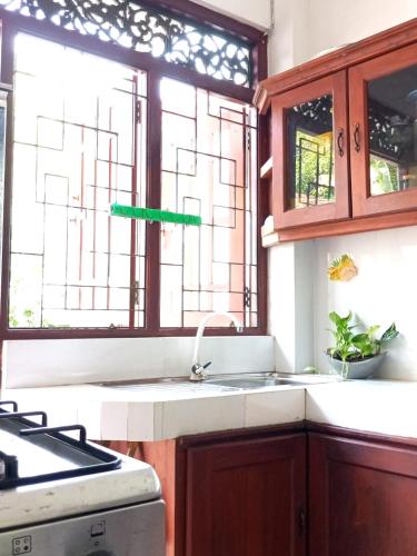 a kitchen with a sink and a window at Kiyara Holiday Villa in Ambalangoda