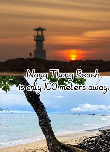 a picture of a beach with a lighthouse and a tree at Happy Lagoon Bungalow in Khao Lak
