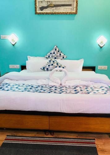 Katil atau katil-katil dalam bilik di Snow Crest Residency - A Pure Veg Hotel