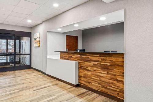 an office with a reception desk with a wooden wall at Hampton Inn Lexington - Georgetown I-75 in Georgetown
