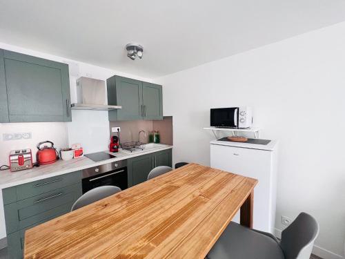 Kuchyň nebo kuchyňský kout v ubytování Le Madone