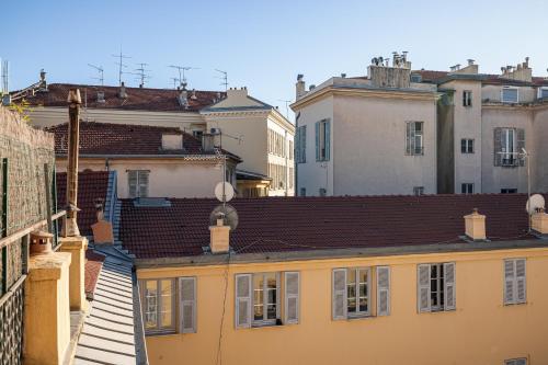 a view of roofs of buildings in a city at Naomi Nice in Nice