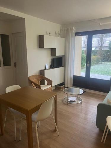 Appartement lumineux en rez-de- jardin