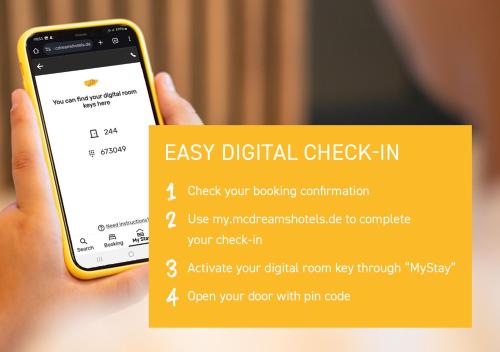 a hand holding a cell phone with a check in at McDreams Hotel Ingolstadt in Ingolstadt