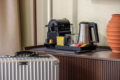 a tray of items on a desk with a suitcase at Naomi Nice in Nice