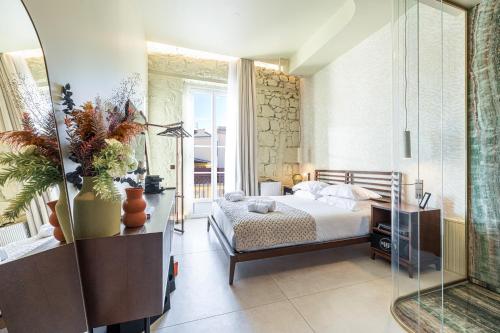 a bedroom with a bed and a mirror at Naomi Nice in Nice