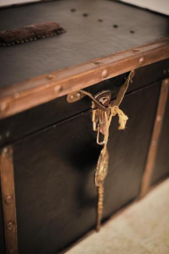 a close up of a wooden chest with a latch at Chez Liart 1 in Fasano