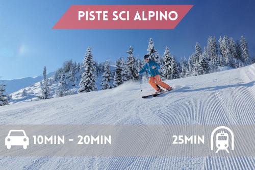 a person is skiing down a snow covered slope at 3 Minuti da Asiago - Zona Tranquilla e Silenziosa in Gallio