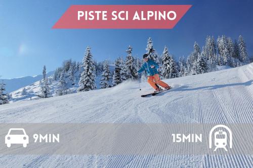 a person is skiing down a snow covered slope at 5 minuti da Asiago - Garage e BBQ in Roana
