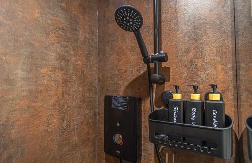 a wall with a hair dryer in a holder at Town centre apartment in Kendal