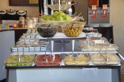 a buffet with different types of food in trays at ADMİRAL in Kayseri