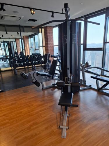 a gym with chairs and treadmills in a building at Ceylonz Suites By ANA MALAYSIA in Kuala Lumpur