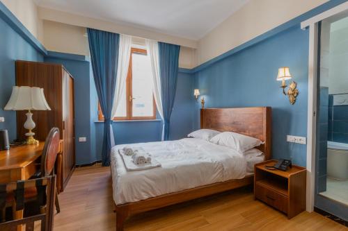Postel nebo postele na pokoji v ubytování Modi Hotel