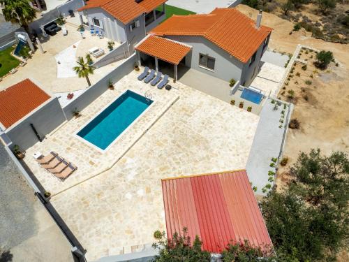 an aerial view of a house with a swimming pool at Villa Chrisa Seaview in Piskopiano - Private Pool in Piskopianon