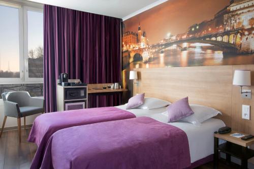 a hotel room with two beds with purple sheets at Best Western Rives de Paris La Defense in Courbevoie