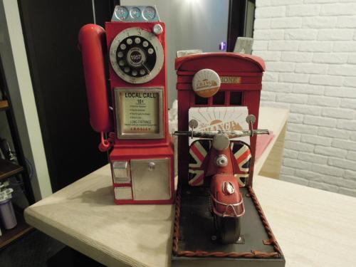 a model of a red telephone booth on a table at Re-Change Hotel Taipei in Taipei
