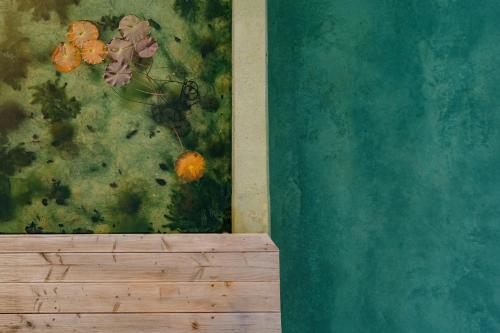 a painting of flowers on a wall in a room at Haus Sibylle in Bad Tölz