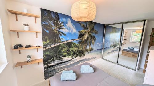 a room with a palm tree mural on the wall at Ranmoor Garden View Apartment in Sheffield