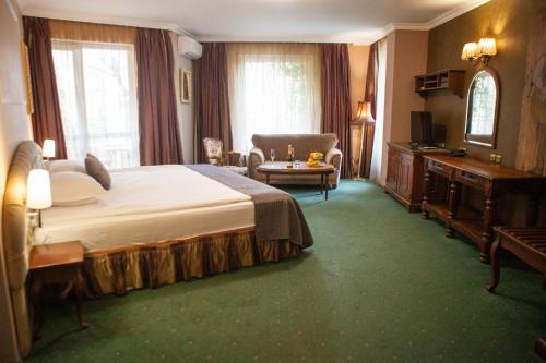 Postel nebo postele na pokoji v ubytování Meg-Lozenetz Hotel