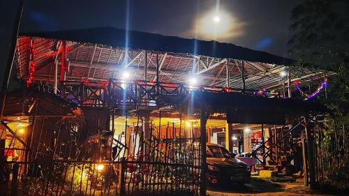 a building with lights on top of it at night at Dreamer Resort in San Vicente