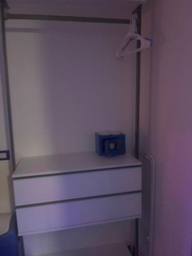 a dresser with a radio sitting on top of it at B&B Santorini in Scalea