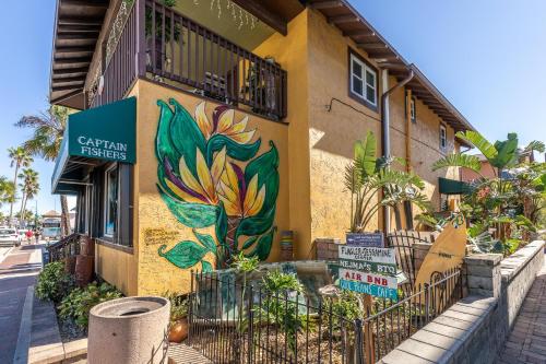 a building with a painting on the side of it at Chadham by the Sea 413 in New Smyrna Beach