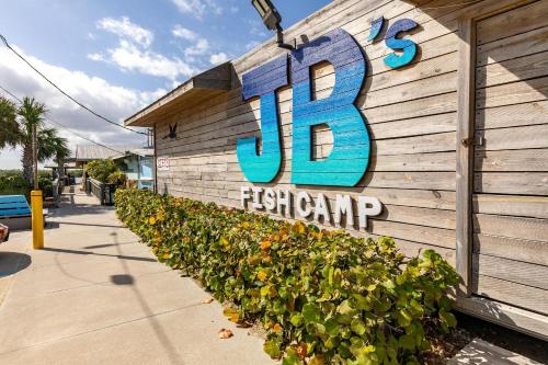 a sign on the side of a building with a seafood restaurant at Chadham by the Sea 413 in New Smyrna Beach