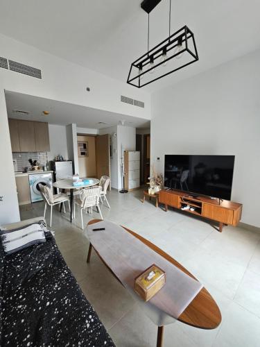 a living room with a couch and a table at Apartment 70 m2 in Sharjah
