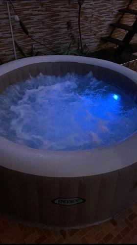 a large hot tub with blue water in it at Villa Dar Lghzal Summer Promo Airport Pick-Up & Private Dining in Heart of Rabat in Rabat
