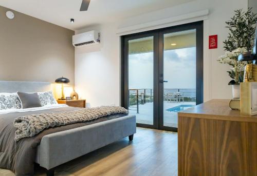 Ένα ή περισσότερα κρεβάτια σε δωμάτιο στο Blue Malibu Home in Camuy