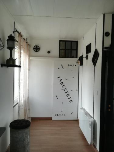 a large clock on a wall in a room at La belle campagne in Granges-dʼAns